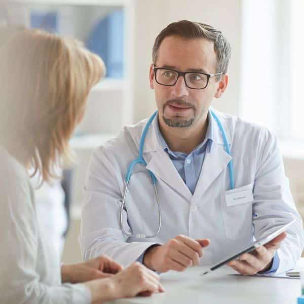 Male doctor with nurse at office