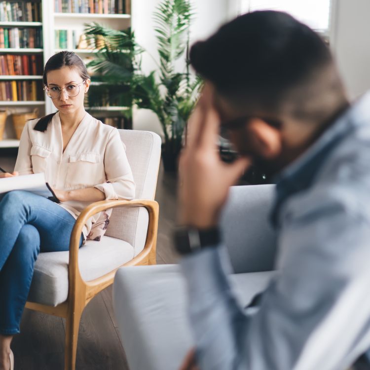 Patient with therapist in an office